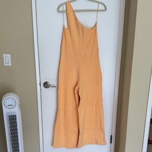 Free People Asymmetrical Jumpsuit in Light Orange